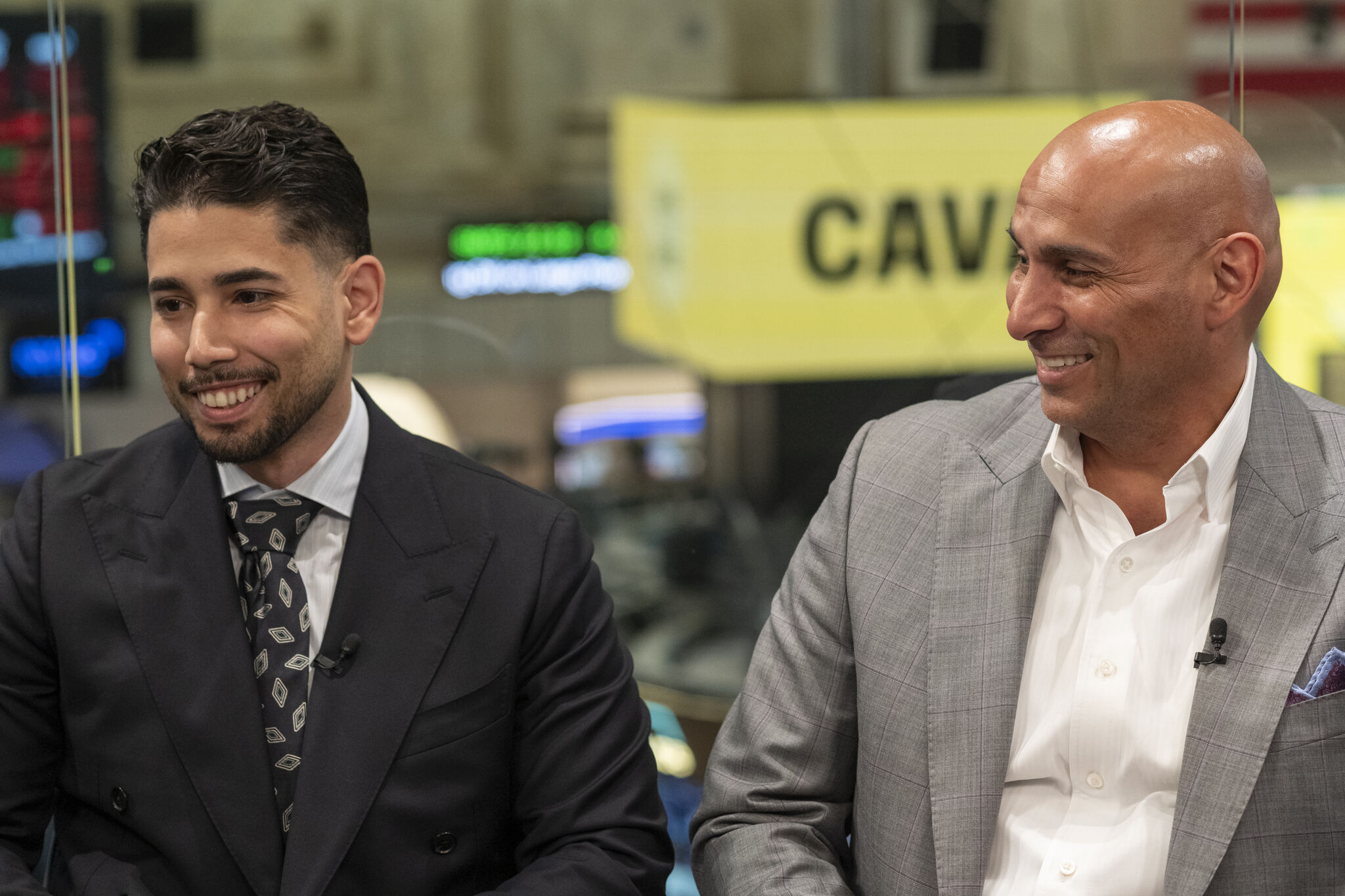 Omar Hafez during a broadcast interview on a stock exchange trading floor