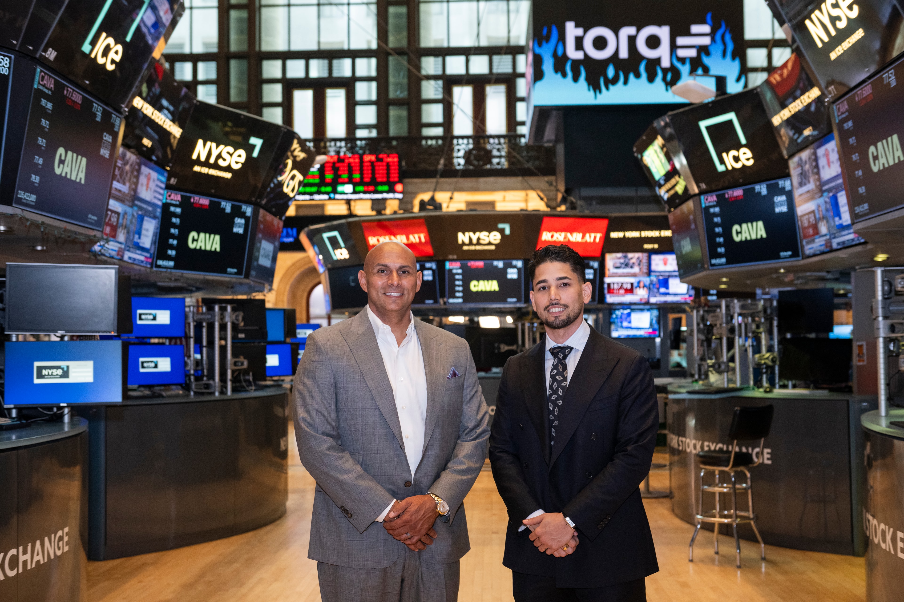Omar Hafez and a colleague on the New York Stock Exchange trading floor