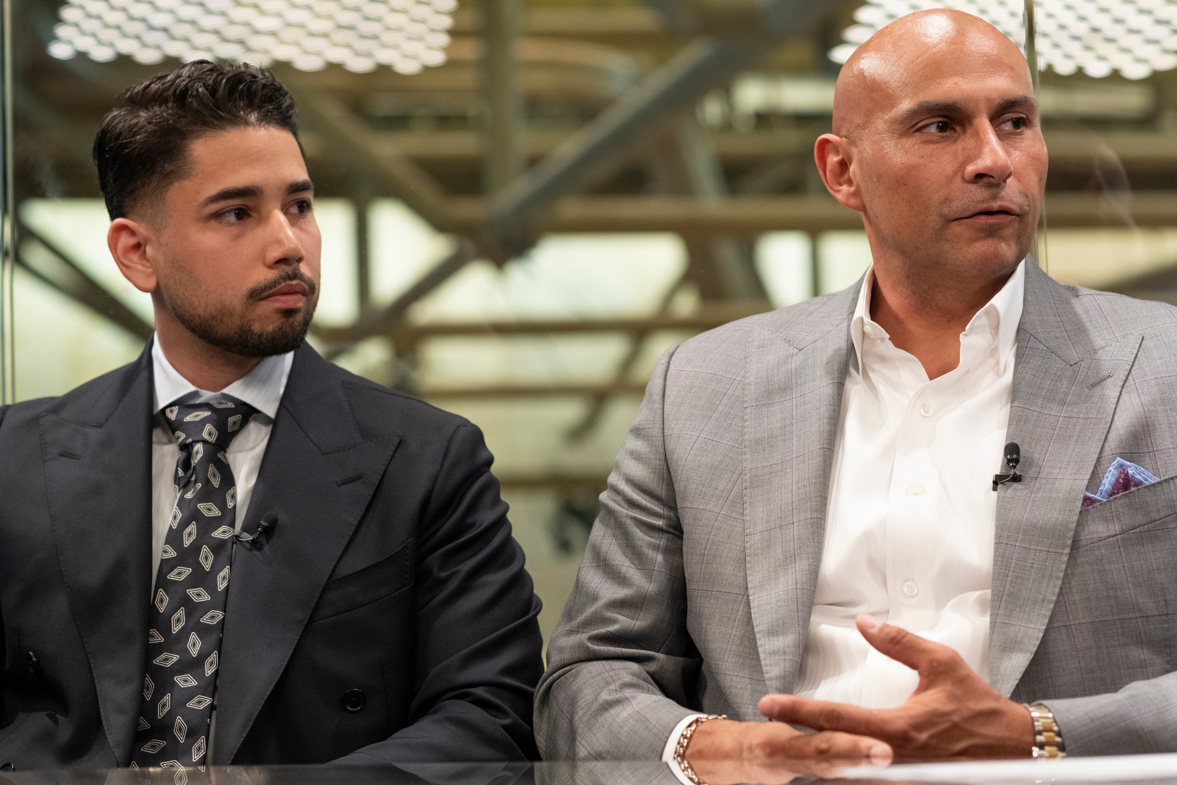 Omar Hafez and a colleague seated side by side during an interview