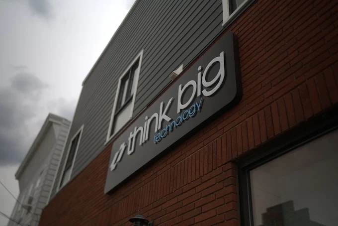 Exterior signage on the Think Big Technology building